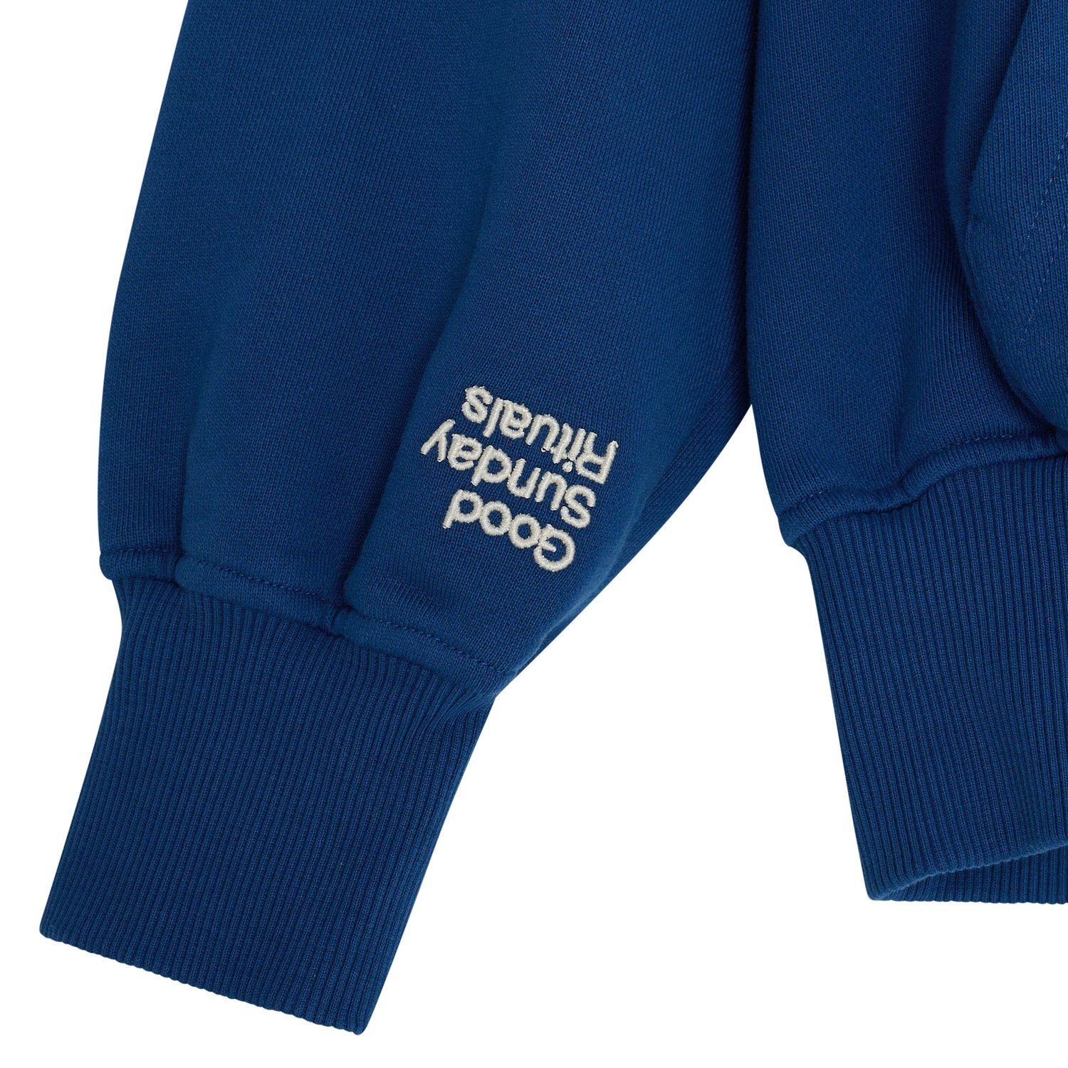 Good Sunday Rituals hoodie cuff embroidery detail flat lay photography