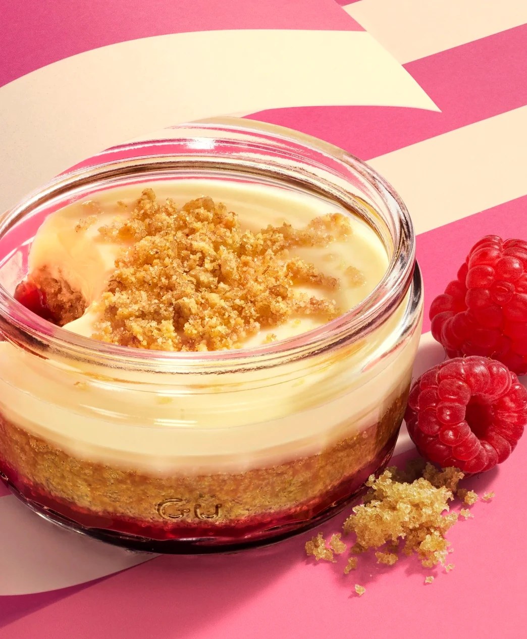 Gü raspberry dessert with a crumble topping in a glass ramekin