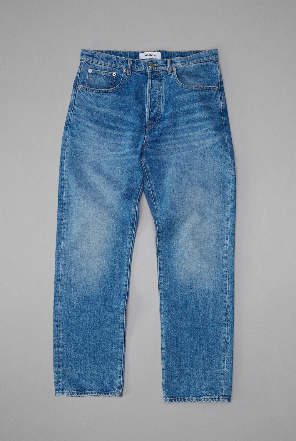 Peace Begins Within mid blue straight jeans flat lay photography