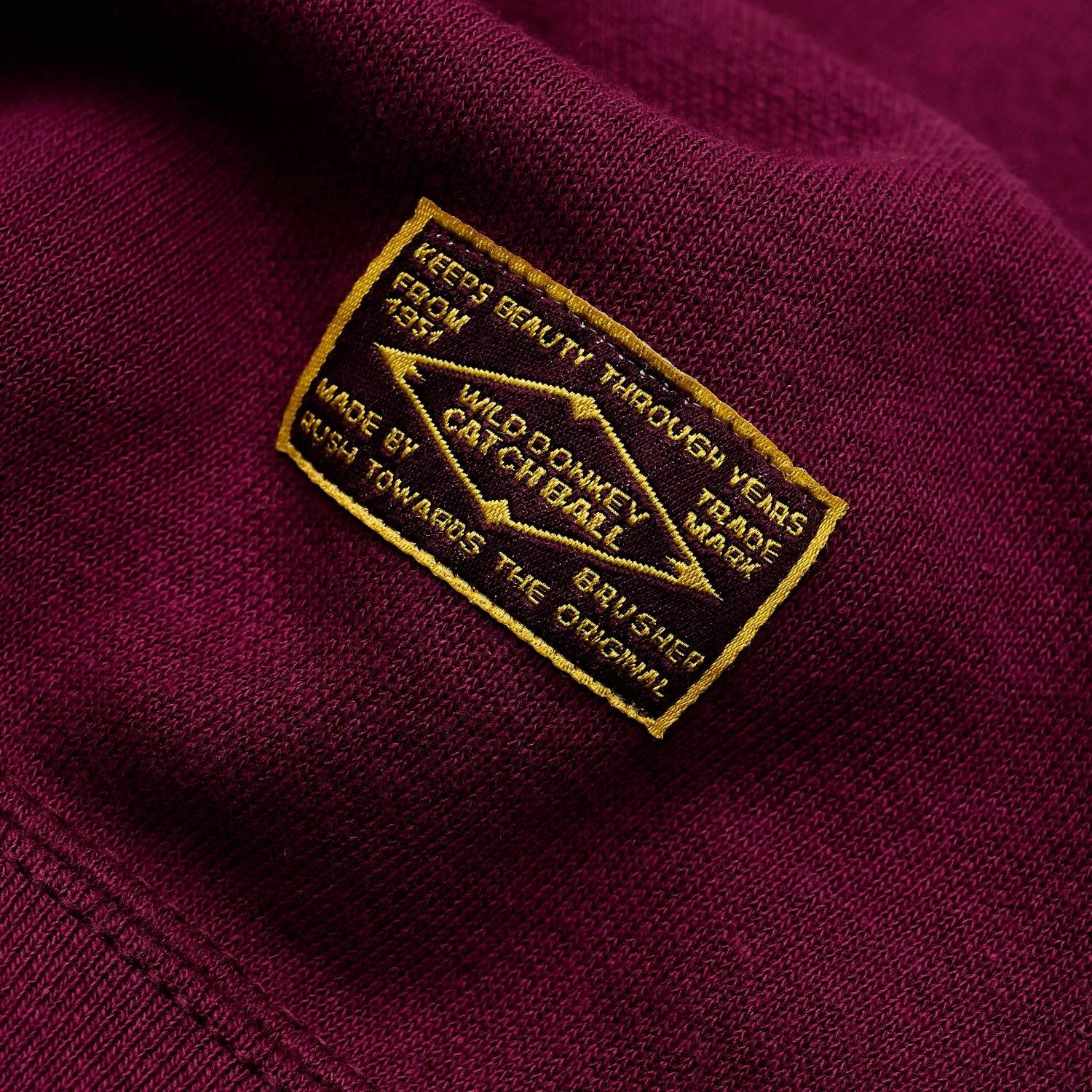 Wild Donkey CatchBall woven label detail flat lay photography
